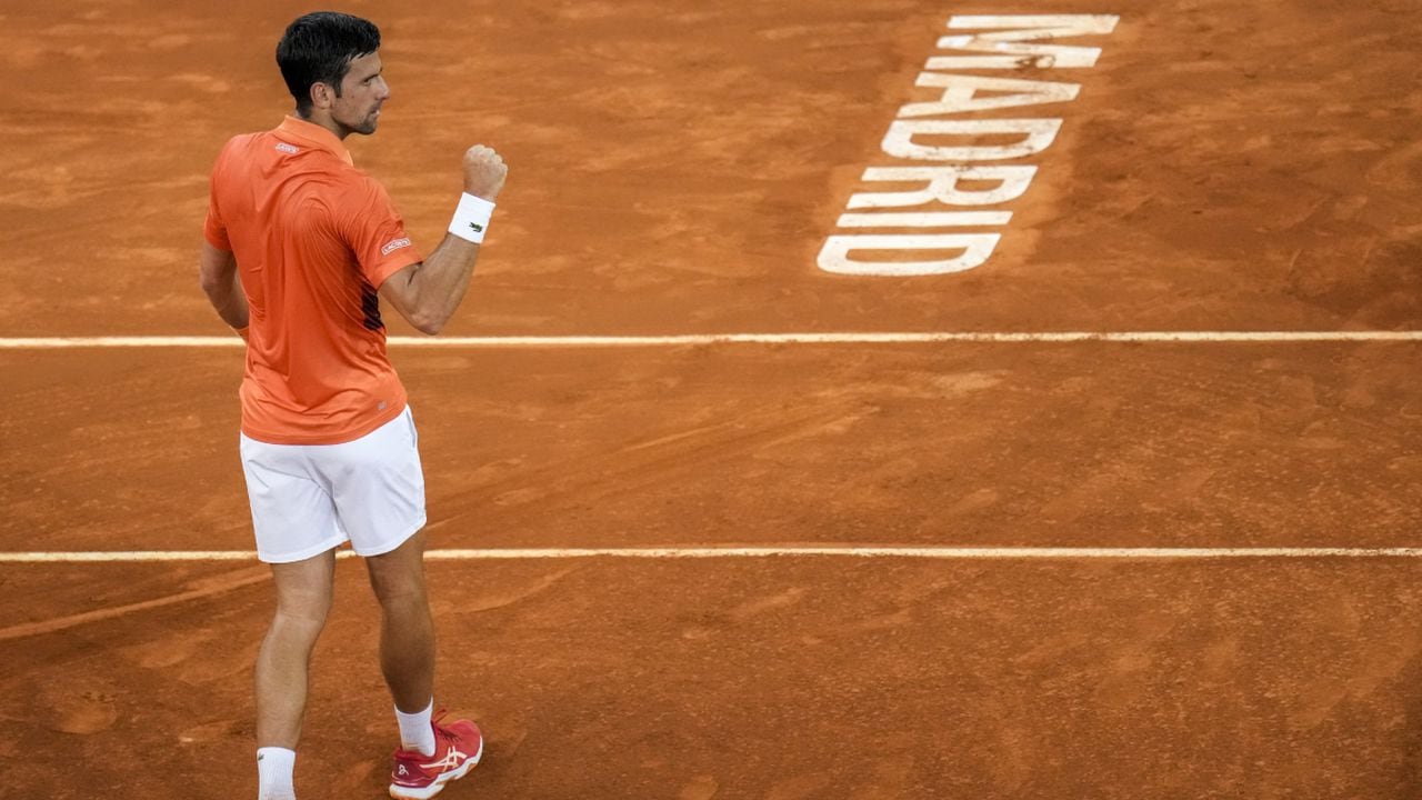 Serbia's Novak Djokovic celebrates his victory over Gael Monfils, of France, during their match at the Mutua Madrid Open tennis tournament in Madrid, Spain, Tuesday, May 3, 2022. (AP/Manu Fernandez)