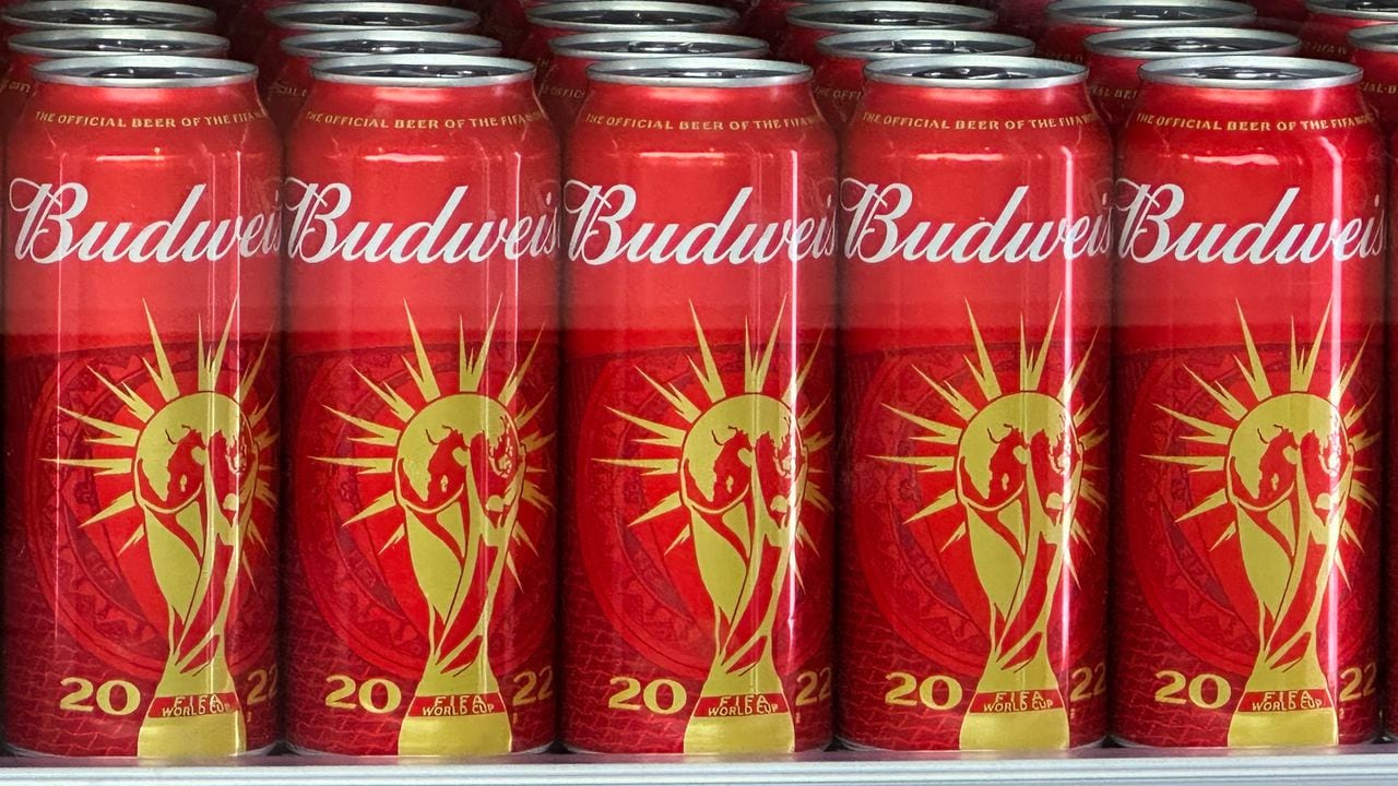 Cans of Budweiser beer featuring the FIFA World Cup logo are displayed in Doha on November 18, 2022 ahead of the Qatar 2022 World Cup football tournament. - The sale of alcohol in Qatar is strictly regulated. (Photo by Patrick T. FALLON / AFP)