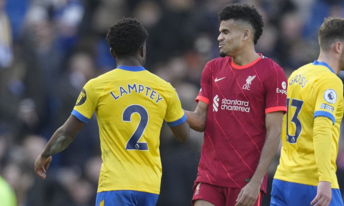 Liverpool's Luis Diaz, right, cheers with Brighton's Tariq Lamptey at the end of the English Premier League soccer match between Brighton and Hove Albion and Liverpool at the Amex stadium in Brighton, England, Saturday, March 12, 2022. Liverpool won 2-0. (AP/Kirsty Wigglesworth)