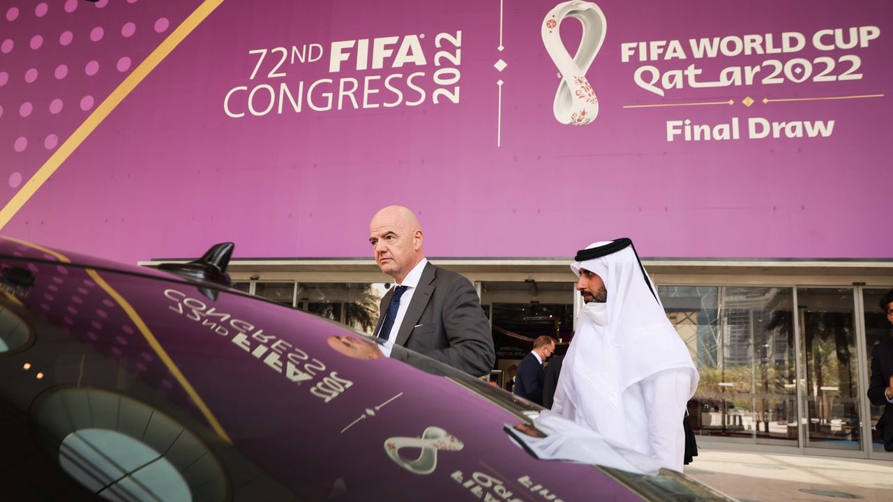 29 March 2022, Qatar, Doha: FIFA President Gianni Infantino (l) gets into his waiting vehicle after a tour of the Doha Exhibition & Convention Center (DECC) in the West Bay district. The DECC will host the Fifa Congress on March 31 and the group draw for the 2022 World Cup in Qatar on April 1. Photo: Christian Charisius/dpa (Photo by Christian Charisius/picture alliance via Getty Images)