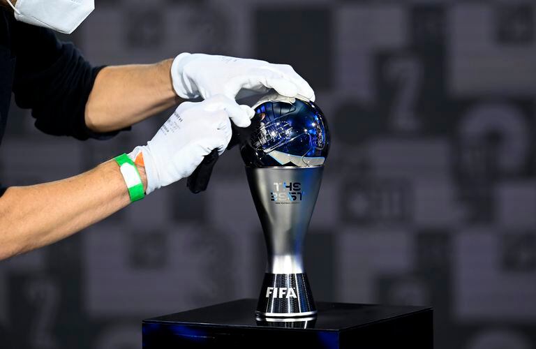 ZURICH, SWITZERLAND - DECEMBER 17: The Best FIFA Award is cleaned prior to the The Best FIFA Football Awards on December 17, 2020 in Zurich, Switzerland. (Photo by Valeriano Di Domenico - Pool/Getty Images)