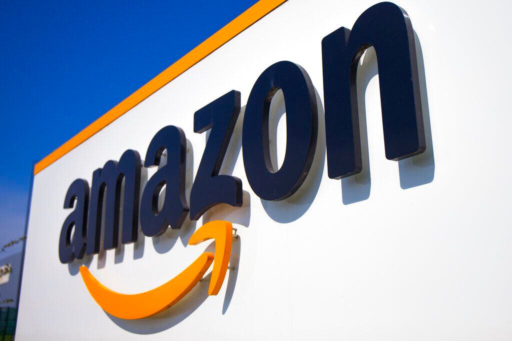 FILE - In this Thursday April 16, 2020 file photo, The Amazon logo is seen in Douai, northern France. Amazon is suing the attorney general of New York in a bid to stop her from suing the company over its coronavirus safety protocols and the firing of one of its outspoken workers, Friday, Feb. 12, 2021. (AP Photo/Michel Spingler, File)