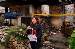FILE PHOTO: Released hostage Amit Soussana, kidnapped on the deadly October 7 attack by Palestinian Islamist group Hamas, talks to the press in front of her destroyed home at the Kibbutz Kfar Aza, Israel, January 29, 2024. REUTERS/Alexandre Meneghini/File Photo