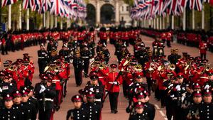 Military personnel parade as the coffin of Queen Elizabeth II is carried following her funeral service in Westminster Abbey in central London, Monday, Sept. 19, 2022. The Queen, who died aged 96 on Sept. 8, will be buried at Windsor alongside her late husband, Prince Philip, who died last year. (AP Photo/Vadim Ghirda, Pool)
