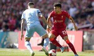 Liverpool's Luis Diaz, right, runs with the ball by Manchester City's Joao Cancelo during the English FA Cup semifinal soccer match between Manchester City and Liverpool at Wembley stadium in London, Saturday, April 16, 2022. (AP Photo/Kirsty Wigglesworth)
