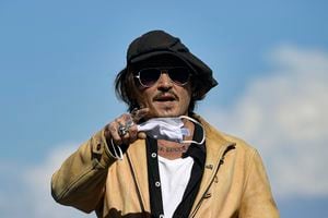 US actor and film producer Johnny Deep, gestures during the photocall to promotes his film "Crock of Gold: A Few Rounds with Shane Macgoman" at the 68th San Sebastian Film Festival, in San Sebastian, northern Spain, Sunday, Sept. 20, 2020. (AP Photo/Alvaro Barrientos)