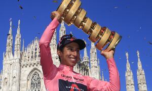 (FILES) In this file photo taken on May 30, 2021, Team Ineos rider Colombia's Egan Bernal celebrates with the race's Trofeo Senza Fine (Endless Trophy) on the podium after winning the Giro d'Italia 2021 cycling race following the 21st and last stage in Milan, Italy. Former Tour de France winner Egan Bernal was "conscious" and "stable" in hospital following a training accident near his home town in Colombia, his cycling team Ineos Grenadiers said on Monday January 24, 2022.
Luca Bettini / AFP