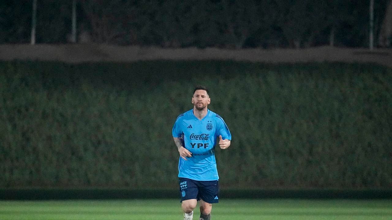 Lionés Messi jogs during a training session of Argentina's national soccer team in Doha, Saturday, Nov. 19, 2022. (AP Photo/Jorge Saenz)