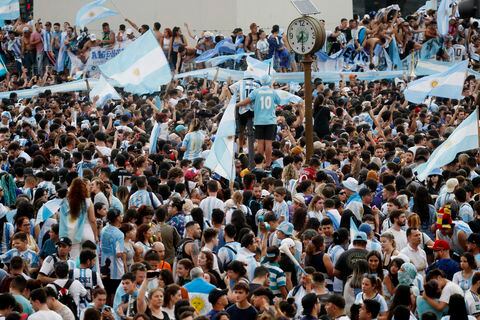 Soccer Football - FIFA World Cup Qatar 2022 - Fans in Buenos Aires watch Argentina v Croatia - Buenos Aires, Argentina - December 13, 2022 Argentina fans celebrate after the match as Argentina progress to the final REUTERS/Agustin Marcarian