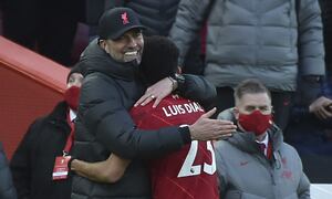 Liverpool's manager Jurgen Klopp, left hugs Liverpool's Luis Diaz as he is substituted during the English Premier League soccer match between Liverpool and Norwich City and at Anfield stadium in Liverpool, England, Saturday, Feb. 19, 2022. (AP Photo/Rui Vieira)
