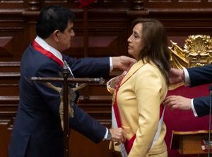 President of the Peruvian Congress Jose Williams Zapata (L) swears in Dina Boluarte (R) as the new President hours after former President Pedro Castillo was impeached in Lima, on December 7, 2022. - Peru's Pedro Castillo was impeached and replaced as president by his deputy on Wednesday in a dizzying series of events in the country that has long been prone to political upheaval. Dina Boluarte, a 60-year-old lawyer, was sworn in as Peru's first female president just hours after Castillo tried to wrest control of the legislature in a move criticised as an attempted coup. (Photo by Cris BOURONCLE / AFP)