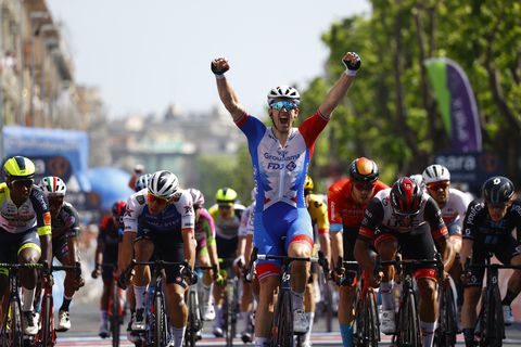 Team Groupama-FDJ's French rider Arnaud Demare celebrates as he crosses the finish line to win the 4th stage of the Giro d'Italia 2022 cycling race, 174 kilometers between Catania and Messina, Sicily, on May 11, 2022. (Photo by Luca Bettini / AFP)