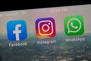 FILE - This photo shows the mobile phone app logos for, from left, Facebook, Instagram and WhatsApp in New York, Oct. 5, 2021. WhatsApp is adding more details to its privacy policy and flagging the information for European users. The update is to comply with a ruling from Irish regulators who slapped the chat service with a record fine for breaching strict EU data privacy rules. Starting Monday, Nov. 22 WhatsApp’s privacy policy will be reorganized to provide more information on the data it collects and how it’s used.  (AP Photo/Richard Drew, file)