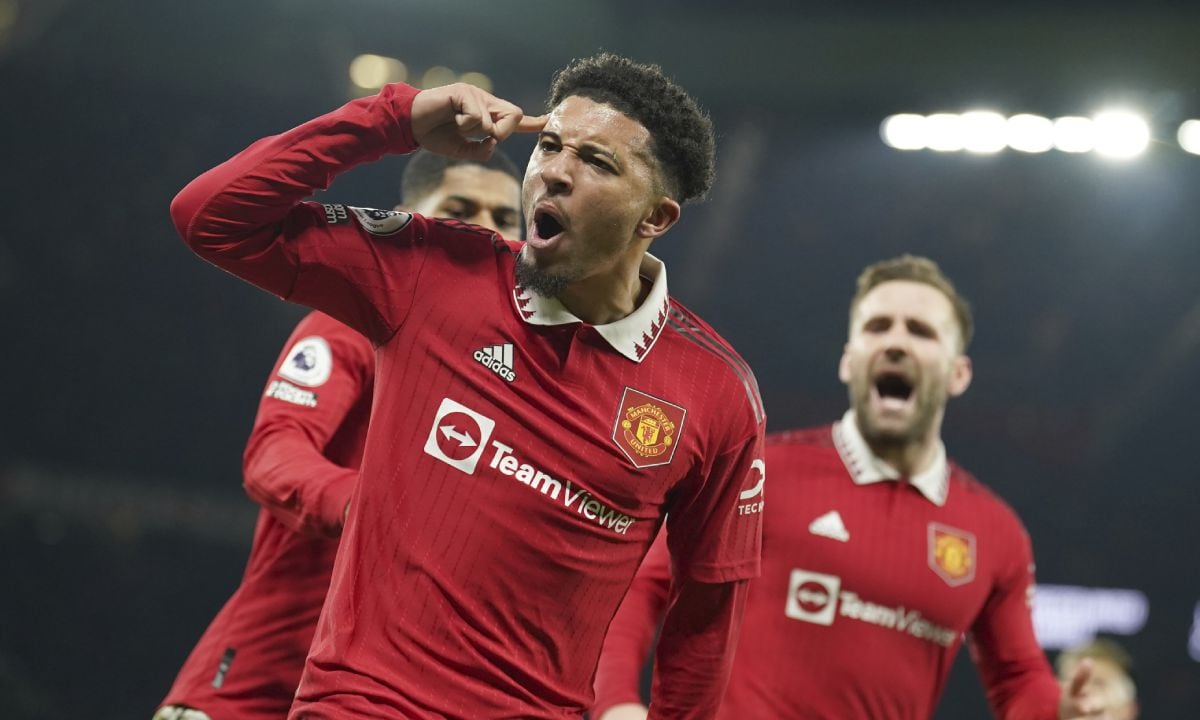 Manchester United's Jadon Sancho celebrates after scoring his sides second goal during the English Premier League soccer match between Manchester United and Leeds United at Old Trafford in Manchester, England, Wednesday, Feb. 8, 2023. (AP/Dave Thompson)