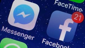 PARIS, FRANCE - APRIL 06:  In this photo illustration, the logo of the Messenger and Facebook applications are displayed on the screen of an Apple iPhone on April 06, 2018 in Paris. In the midst of turmoil following the Cambridge Analytica scandal, Facebook faces a host of questions regarding its privacy and confidentiality practices. Messenger, the messaging application launched by Facebook, is in the center of attention. Indeed, Facebook allows itself to analyze the links and images that users send to Messenger and even to read the messages exchanged if they are posted, in order to make sure that the contents comply with the conditions of use. This increased monitoring of Facebook within its messaging application was confirmed by Mark Zuckerberg a few days ago.(Photo Illustration by Chesnot/Getty Images)