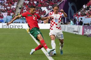 Croatia's Luka Modric (10) and Morocco's Achraf Hakimi (2) compete for the ball during the World Cup group F soccer match between Morocco and Croatia, at the Al Bayt Stadium in Al Khor , Qatar, Wednesday, Nov. 23, 2022. (AP Photo/Themba Hadebe)