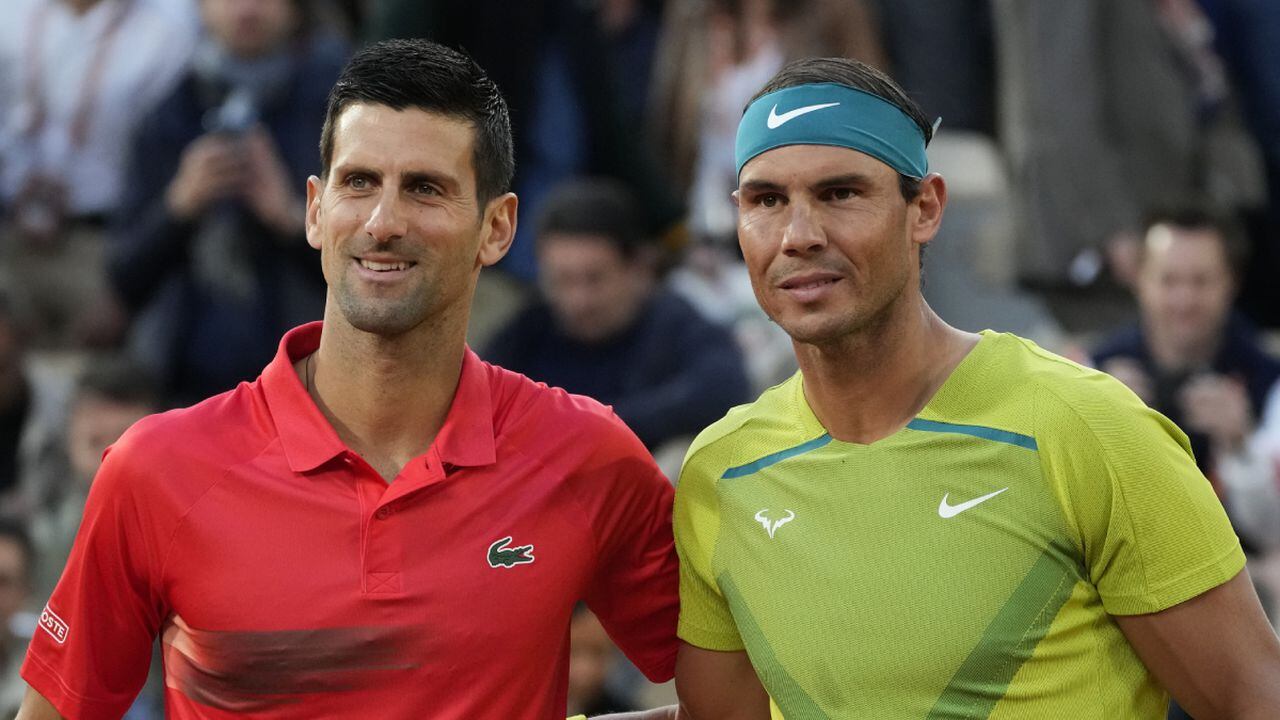 Serbia's Novak Djokovic, left, and Spain's Rafael Nadal pose ahead of their quarterfinal match at the French Open tennis tournament in Paris, France, Tuesday, May 31, 2022. The Australian Open tennis tournament begins Monday, Jan. 16, 2023. Nadal is the defending champion and who owns a men’s-record 22 majors. It is Djokovic, though, who will draw the most attention. (AP Photo/Christophe Ena