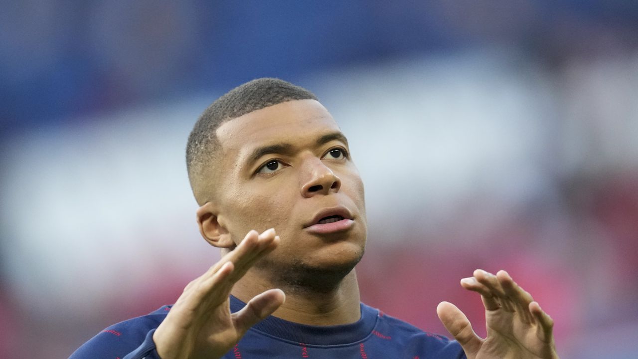 PSG's Kylian Mbappe warms up prior to the start of the French League One soccer match between Paris Saint Germain and Troyes at the Parc des Princes stadium in Paris, Sunday, May 8, 2022. (AP Photo/Christophe Ena)