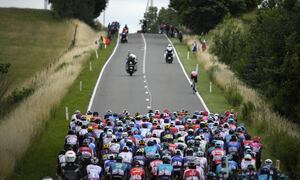The pack rides during the sixth stage of the Tour de France cycling race over 220 kilometers (136.7 miles) with start in Binche and finish in Longwy, France, Thursday, July 7, 2022. (AP/Daniel Cole)
