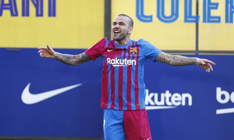 Dani Alves gestures wearing his new team shirt during his official presentation for FC Barcelona in Barcelona, Spain, Wednesday, Nov. 17, 2021. Veteran full back Dani Alves has returned to Barcelona at age 38 to finish out the rest of the season with the team. Alves formed part of Barcelona's greatest era from 2008 to 2016 and helped it win 23 titles, including three Champions League trophies and six Spanish leagues.(AP/Joan Monfort)