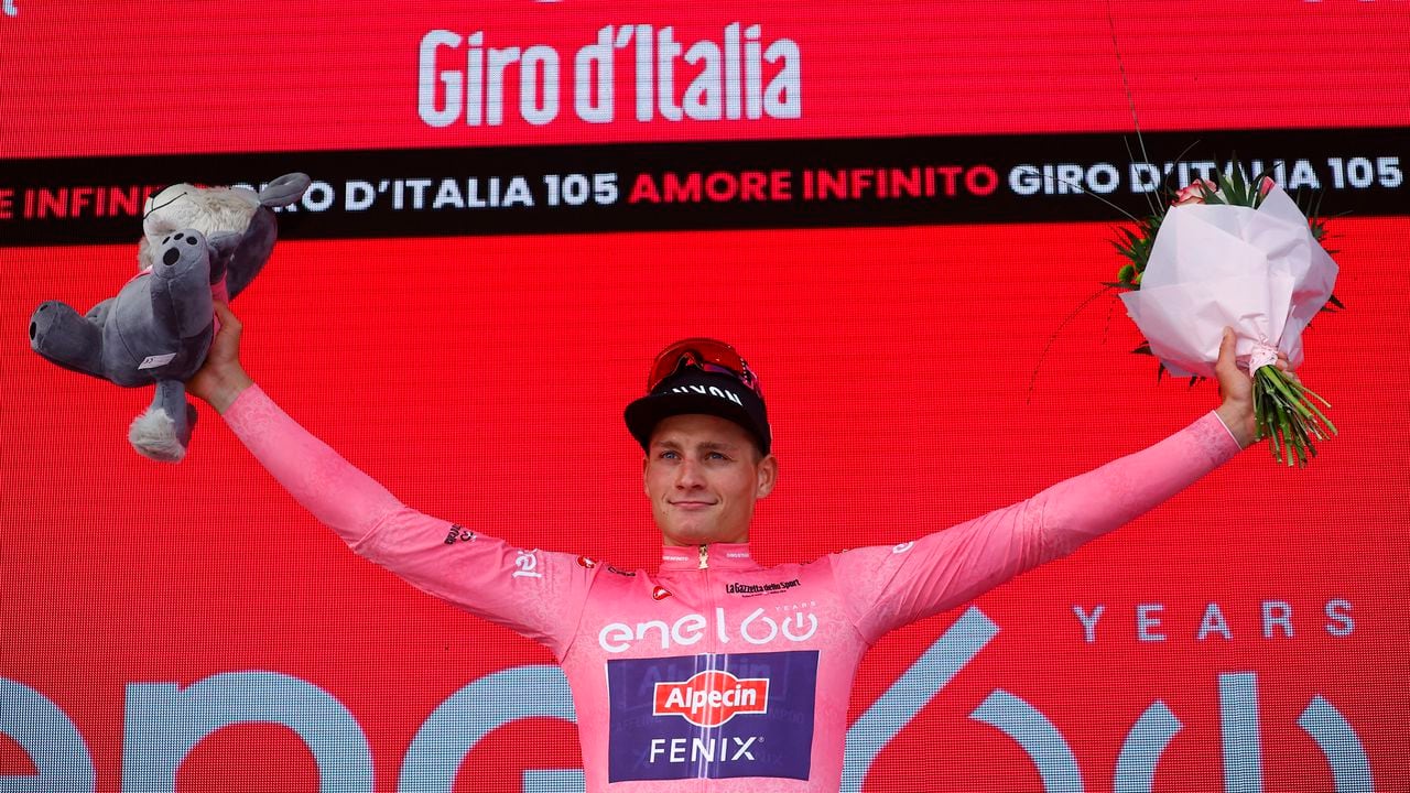 Team Alpecin-Fenix Dutch rider Mathieu van der Poel, wearing the overall leader's pink jersey, celebrates on the podium after winning the first stage of the Giro d'Italia 2022 cycling race, 195 kilometers between Budapest and Visegrad, Hungary, on May 6, 2022. (Photo by Luca Bettini / AFP)