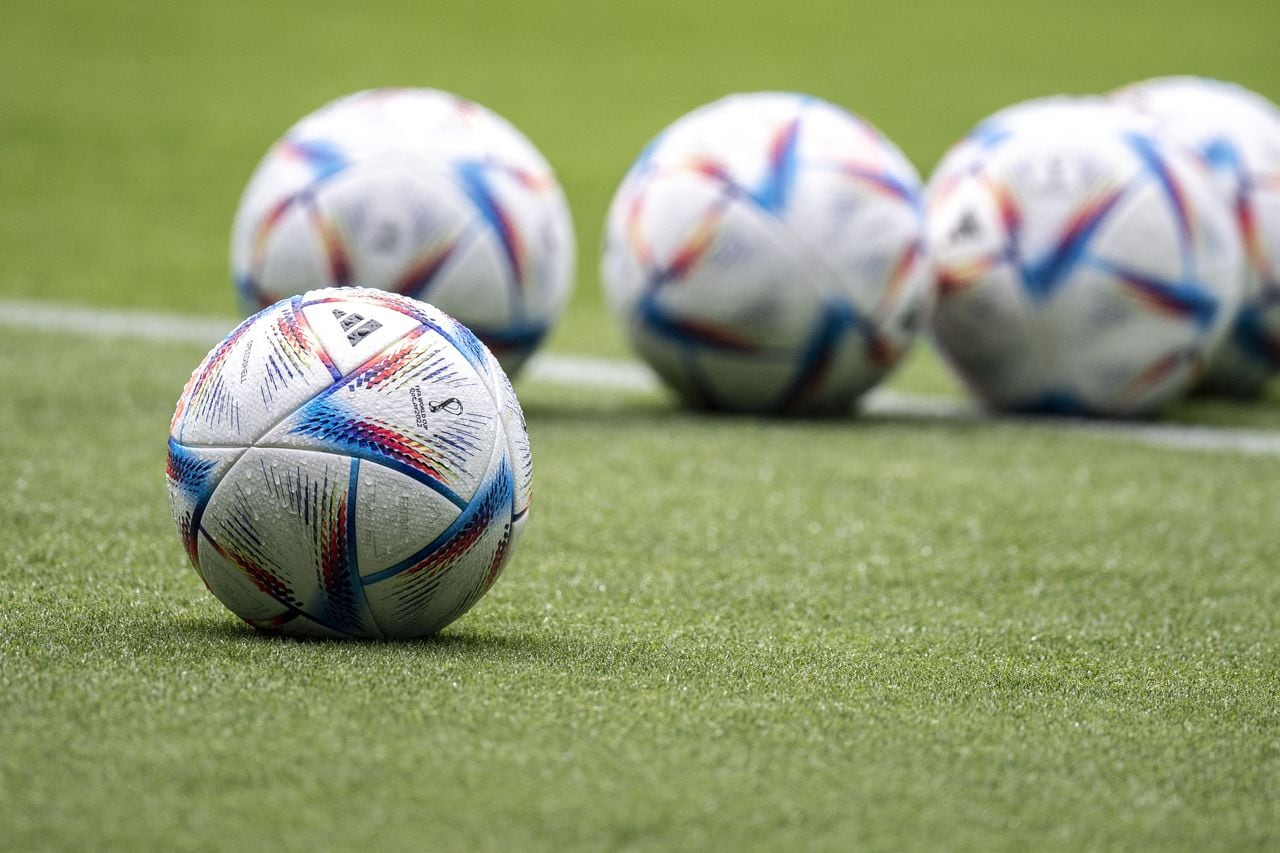 This picture shows the official FIFA World Cup Qatar 2022 footballs called "Al Rihla" during Japan's training session at the Panasonic stadium in Suita, Osaka prefecture on June 13, 2022, ahead of their Kirin Cup final match against Tunisia on June 14. (Photo by Charly TRIBALLEAU / AFP)