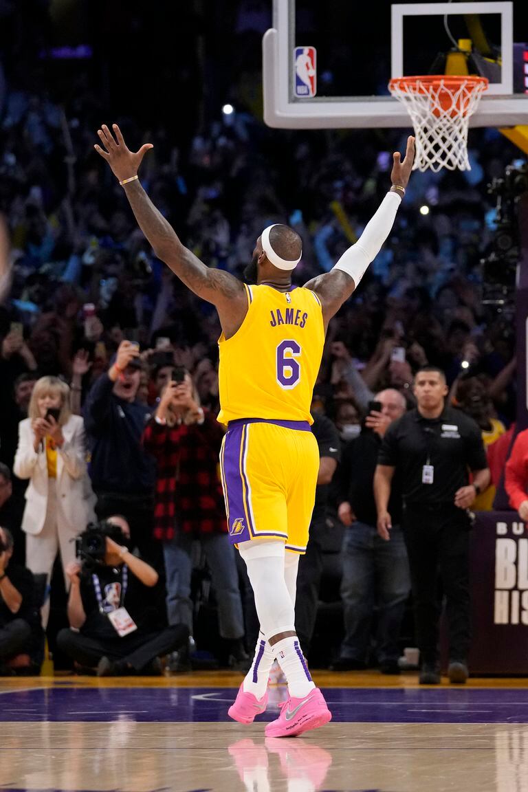 Los Angeles Lakers forward LeBron James celebrates after passing Kareem Abdul-Jabbar to become the NBA's all-time leading scorer during the second half of an NBA basketball game against the Oklahoma City Thunder Tuesday, Feb. 7, 2023, in Los Angeles.(AP Photo/Ashley Landis)