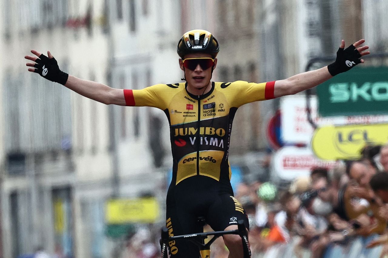 Jumbo-Visma's Danish rider Jonas Vingegaard celebrates as he crosses the finish line to win the fifth stage of the 75th edition of the Criterium du Dauphine cycling race, 191,5km  between Cormoranche-sur-Saone and Salins-Les-Bains,  on June 8, 2023. (Photo by Anne-Christine POUJOULAT / AFP)