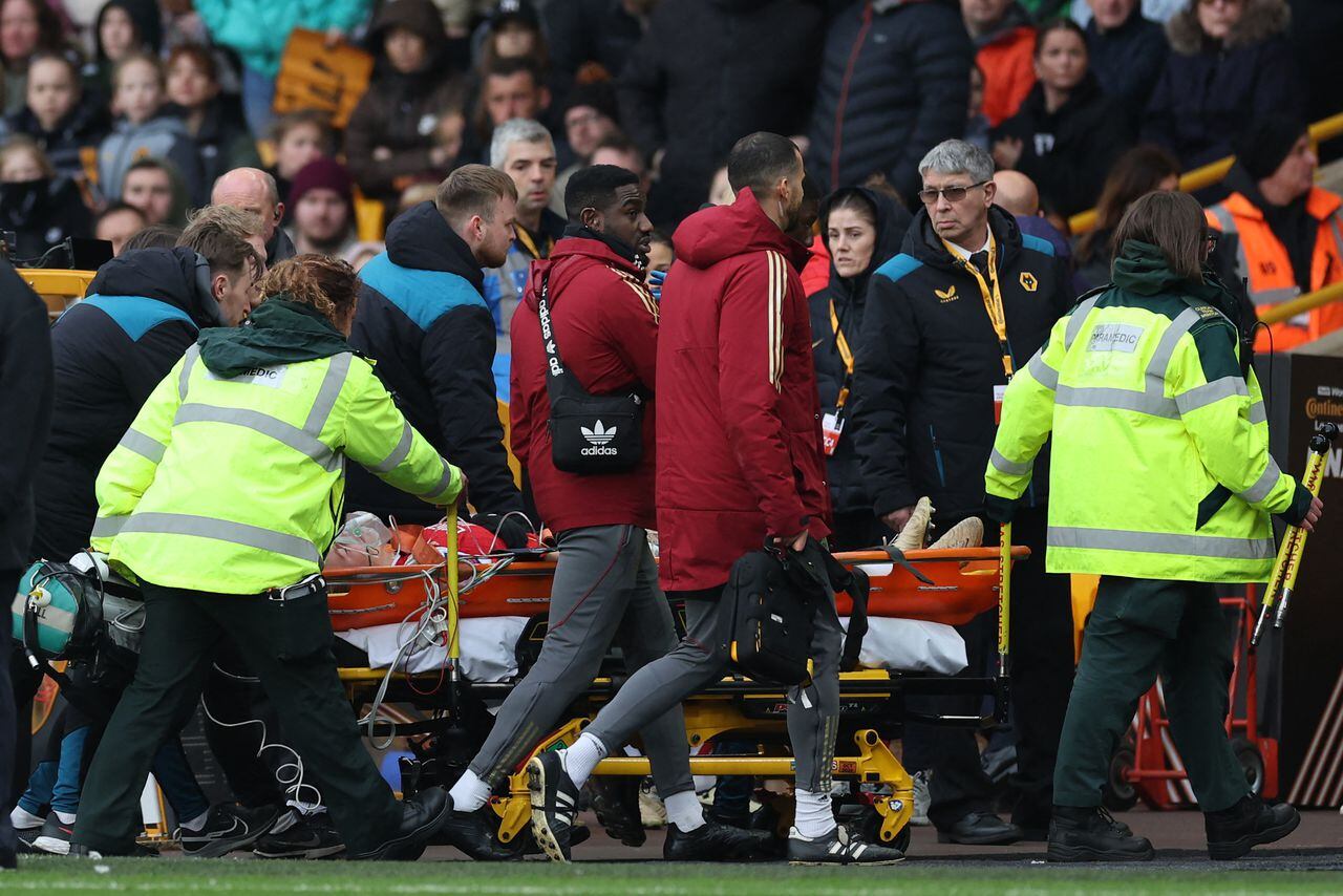 Arsenal's Norwegian midfielder #12 Frida Maanum is taken from the pitch on a stretcher after being taken ill during the English Women's League Cup final football match between Arsenal and Chelsea at Molineux in Wolverhampton, central England on March 31, 2024. (Photo by Adrian DENNIS / AFP)
