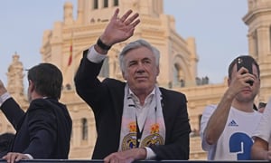 Real Madrid's head coach Carlo Ancelotti waves during celebrations after Real Madrid won the Spanish La Liga title by defeating Espanyol in Madrid, Spain, Saturday, April 30, 2022. (AP Photo/Paul White)