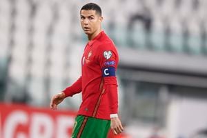 Portugal's Cristiano Ronaldo walks on the pitch during the World Cup 2022 group A qualifying soccer match between Portugal and Azerbaijan at the Juventus Stadium in Turin, Italy, Wednesday, March 24, 2021. (Fabio Ferrari/LaPresse via AP)