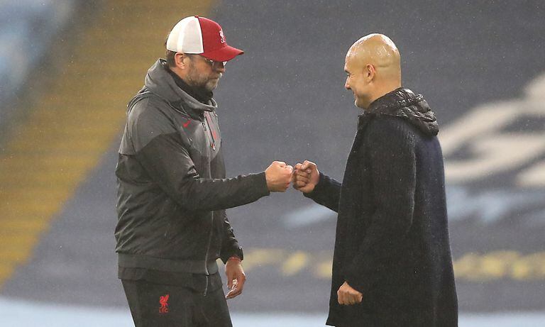 Liverpool manager Jurgen Klopp (left) and Manchester City manager Pep Guardiola after the final whistle during the Premier League match at the Etihad Stadium, Manchester. (Photo by Getty Images/Martin Rickett/PA Images)
