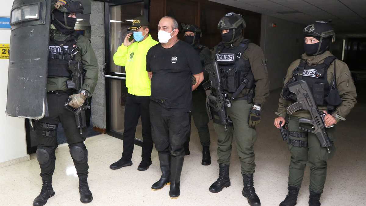 Dairo Antonio Usuga David, alias "Otoniel", top leader of the Gulf clan, is escorted by Colombian military after being captured, in Turbo
