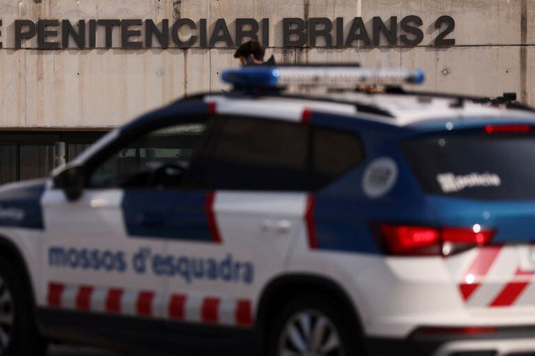A police car drives past the entrance of Brians 2 prison where Brazilian soccer player Dani Alves was taken after a judge ordered him to be jailed on remand without bail over an alleged sexual assault of a woman in Barcelona, Spain February 16, 2023. REUTERS/Nacho Doce