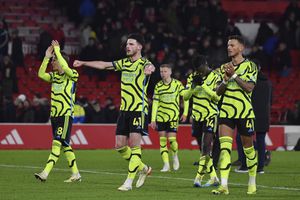 Arsenal's players wave their supporters at the end of the English Premier League soccer match between Nottingham Forest and Arsenal at the City Ground stadium in Nottingham, England, Tuesday, Jan. 30, 2024. Arsenal won 2-1. (AP Photo/Rui Vieira)