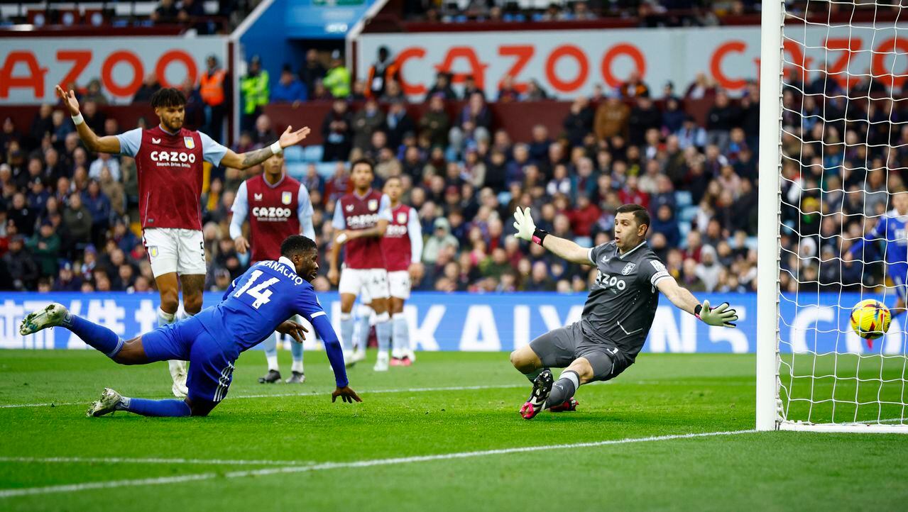 Soccer Football - Premier League - Aston Villa v Leicester City - Villa Park, Birmingham, Britain - February 4, 2023 Leicester City's Kelechi Iheanacho scores their second goal past Aston Villa's Emiliano Martinez Action Images via Reuters/John Sibley EDITORIAL USE ONLY. No use with unauthorized audio, video, data, fixture lists, club/league logos or 'live' services. Online in-match use limited to 75 images, no video emulation. No use in betting, games or single club /league/player publications. Please contact your account representative for further details.