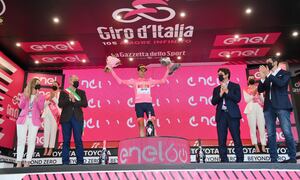 Spain's Juan Pedro Lopez Perez celebrates on the podium as he wears the pink jersey of the overall leader at the end of the 10th stage of the Giro D'Italia cycling race from Pescara to Jesi, Italy, Tuesday, May 17, 2022. (Gian Mattia D'Alberto/LaPresse via AP)