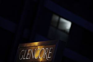 Light reflects on signage at sunset near the Glencore Plc headquarters office in Baar, Switzerland, on Friday, July 6, 2018. Glencore will buy back as much as $1 billion of its shares, a move that may soothe investor concerns after the worlds top commodity trader was hit by a U.S. Department of Justice probe earlier this week. Photographer: Stefan Wermuth/Bloomberg via Getty Images