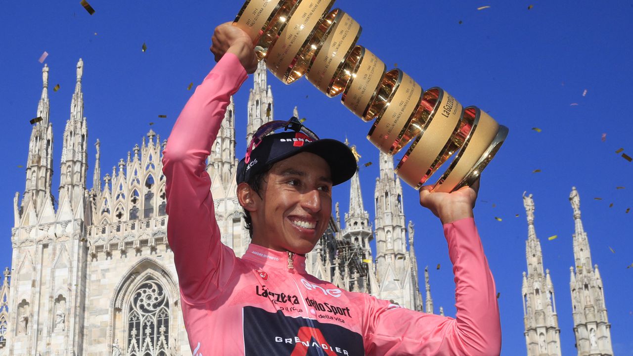 (FILES) In this file photo taken on May 30, 2021, Team Ineos rider Colombia's Egan Bernal celebrates with the race's Trofeo Senza Fine (Endless Trophy) on the podium after winning the Giro d'Italia 2021 cycling race following the 21st and last stage in Milan, Italy. Former Tour de France winner Egan Bernal was "conscious" and "stable" in hospital following a training accident near his home town in Colombia, his cycling team Ineos Grenadiers said on Monday January 24, 2022.
AFP/Luca Bettini