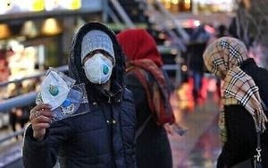 An Iranian street vendor sells protective masks in the capital Tehran on February 20,2020. - Two people have died in Iran yesterday after testing positive for the new coronavirus, the health ministry said, in the Islamic republic's first cases of the disease. (Photo by ATTA KENARE / AFP)