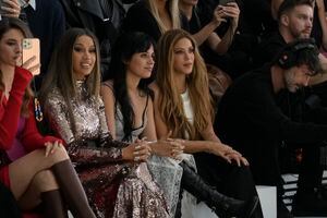 Cardi B, from second left, Camila Cabello and Shakira attend the Fendi Haute Couture Fall/winter 2023-2024 fashion collection presented in Paris, Thursday, July 6, 2023. (AP Photo/Christophe Ena)