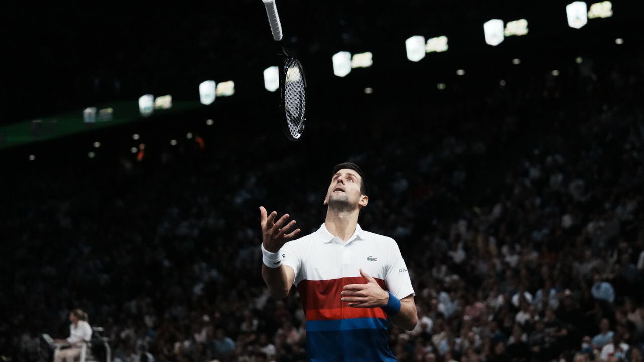 Serbia's Novak Djokovic throws his racket as he plays Russia's Daniil Medvedev during the final match of the Paris Masters tennis tournament at the Accor Arena in Paris, Sunday, Nov.7, 2021. (AP/Thibault Camus)