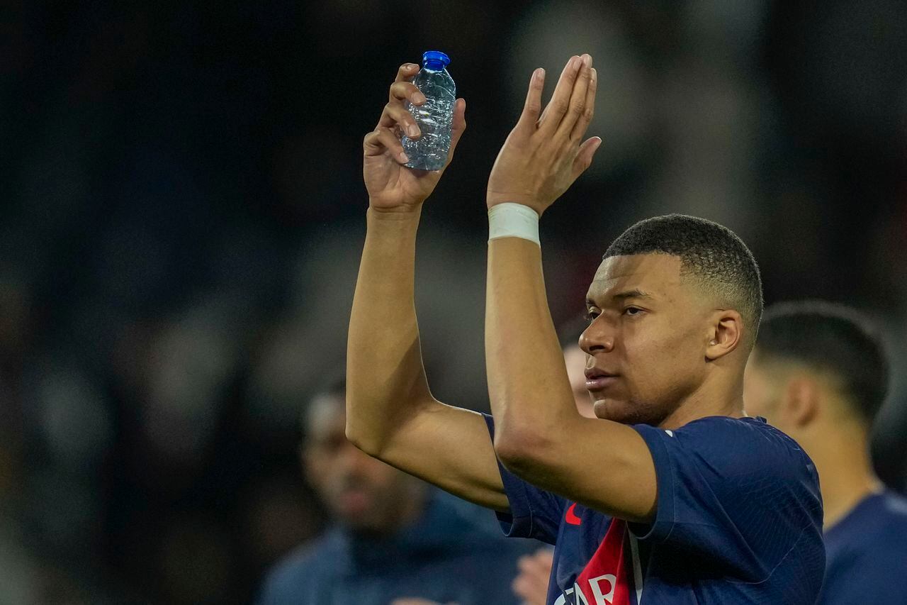 PSG's Kylian Mbappe celebrates at the end of the Champions League round of 16 first leg soccer match between Paris Saint-Germain and Real Sociedad, at the Parc des Princes stadium in Paris, France, Wednesday, Feb. 14, 2024. (AP Photo/Christophe Ena)