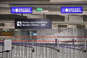 A photograph taken on December 3, 2022 shows empty waiting lines at the border police control points at Roissy-Charles de Gaulle Airport, north of Paris. (Photo by Eric PIERMONT / AFP)