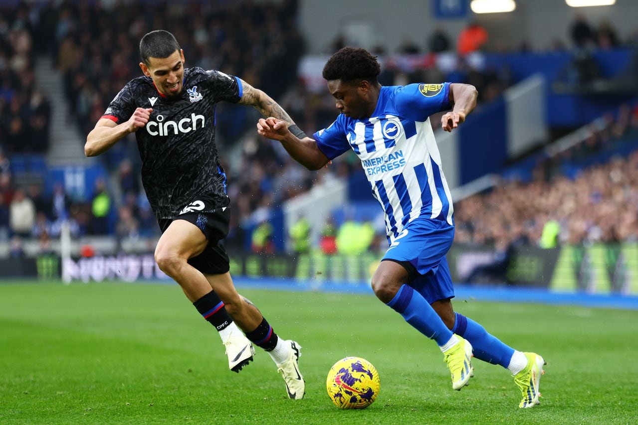 BRIGHTON, ENGLAND - FEBRUARY 03: Tariq Lamptey of Brighton & Hove Albion runs with the ball under pressure from Daniel Muñoz of Crystal Palace during the Premier League match between Brighton & Hove Albion and Crystal Palace at American Express Community Stadium on February 03, 2024 in Brighton, England. (Photo by Bryn Lennon/Getty Images)