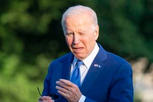 President Joe Biden squints into the sun as he walks from Marine One upon arrival on the South Lawn of the White House, Thursday, June 1, 2023, in Washington. Biden is returning from Colorado. (AP Photo/Alex Brandon)