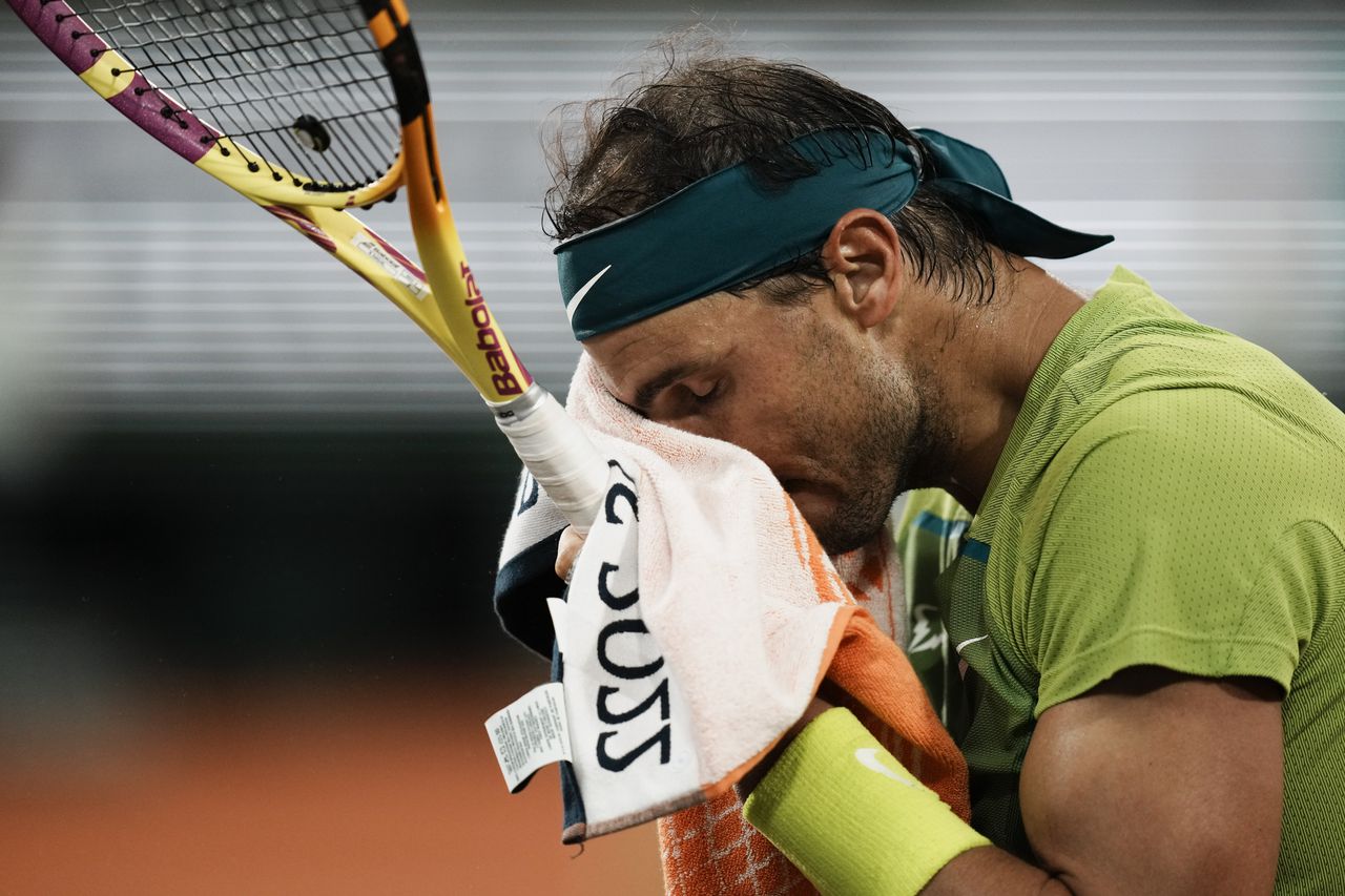Spain's Rafael Nadal wipes the sweat off his face during their semifinal match at the French Open tennis tournament in Roland Garros stadium in Paris, France, Friday, June 3, 2022. (AP Photo/Thibault Camus)