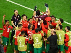 Soccer Football - FIFA World Cup Qatar 2022 - Round of 16 - Morocco v Spain - Education City Stadium, Al Rayyan, Qatar - December 6, 2022 Morocco players throw Yassine Bounou in the air as they celebrate qualifying for the quarter finals REUTERS/Lee Smith