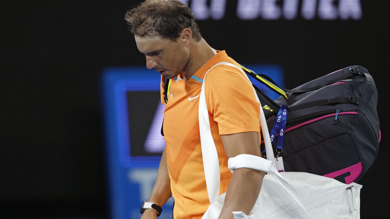 Rafael Nadal of Spain leaves Rod Laver Arena following his second round loss to Mackenzie McDonald of the U.S. at the Australian Open tennis championship in Melbourne, Australia, Wednesday, Jan. 18, 2023. (AP Photo/Asanka Brendon Ratnayake)