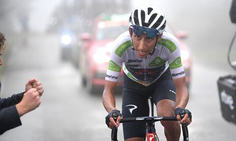 LAGOS DE COVADONGA, SPAIN - SEPTEMBER 01: Egan Arley Bernal Gomez of Colombia and Team INEOS Grenadiers White Best Young Rider Jersey competes in the mist while fans cheer during the 76th Tour of Spain 2021, Stage 17 a 185,5km stage from Unquera to Lagos de Covadonga 1.085m / @lavuelta / #LaVuelta21 / on September 01, 2021 in Lagos de Covadonga, Spain. (Photo by Getty Images/Tim de Waele)